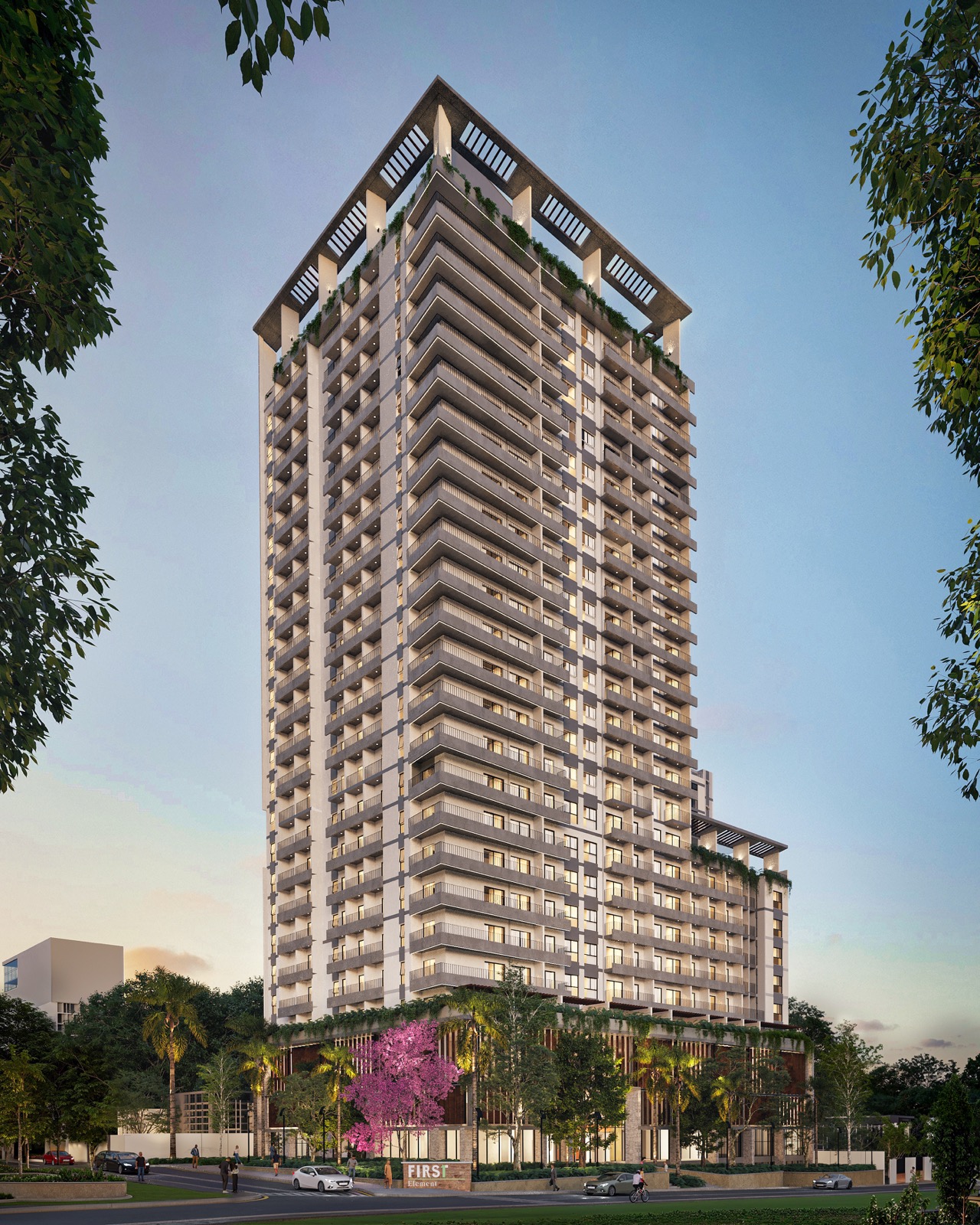 Torre residencial en Asunci&oacute;n al atardecer, con su acceso y las veredas arboladas